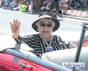 HELEN BERG ENJOYED her ride on Third Street as grand marshal of the Nautical Festival parade.