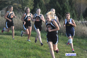 A CROWD OF Huron runners and two opponents, head around a corner in the first mile of the new Moltke course. From left the Huron runners are Camryn Bullock, Amber Nowicki, Jasmine Ramus and Makayla Boris. (Photos by Richard Lamb)