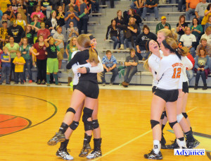 Huron players celebrate match point while Engadine fans realize their season was over. (Photo by Richard Lamb)