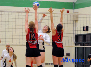 Sarah Meredith attacks the net in the quarterfinal match against Crystal Falls Forest Park. 