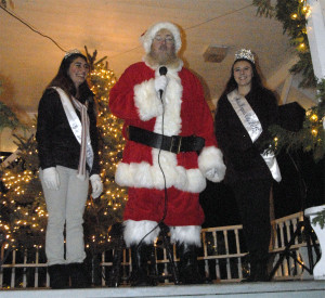 Santa, assisted by Miss Rogers City Heather Hentkowski and court member Salena Hiedemann, get ready to light the Christmas trees in Westminster Park. (Photos by Richard Lamb)
