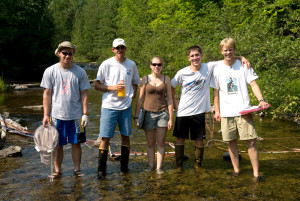A RESEARCH team worked on pheromone identification in the Ocqueoc River. From left are, Henry Thompson, David Partyka, Nicole Griewahn, Aaron Smuda, all local students, and Nick Johnson who at that time was a graduate student at MSU in the Li Lab, now at HBBS full time.   (Photo by T. Lindsey Haskin)
