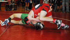 ONAWAY FRESHMAN Gavin Fenstermaker has this match headed in the right direction. He wrestled well during Saturday’s annual Dick Dunn Memorial tournament.    (Photo by Peter Jakey)