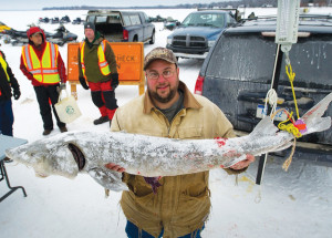 THIS IS the pose many anglers hope to be making during this weekend’s sturgeon season on Black Lake. (File photo)