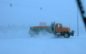 A county plow truck gets rid of a layer of snow as the Feb. 2 storm hit US-23 and the rest of Presque Isle County. (Photo by Richard Lamb)