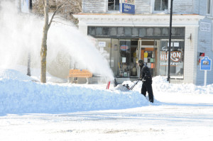 Business owners and government workers had a lot of snow to remove before opening for business Thursday. (Photo by Richard Lamb)