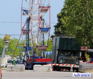 Concrete barricades are in place on festival Thursday in the wake of Wednesday night's crash which sent a van into the Ferris Wheel. (Photo by Richard Lamb)