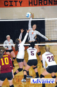 Rogers City middle hitter Taylor Fleming is all over this shot to gain a point for the Hurons. (Photo by Richard Lamb)