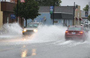 Too much rain for the drains to handle caused temporary flooding on Third Street. The flooding lasted only a few minutes, as city workers cleaned storm drains to ease the problem. (Photos by R<div class='adsense adsense-bottom' style='float:right;margin:12px'><figcaption id=