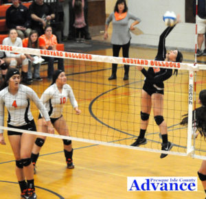 Jayna Hance makes an attack from the back row. She led the team with 17 digs as the team's libero in Thursday's regional championship game. (Photo by Richard Lamb)