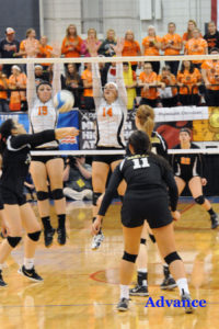 Hannah Fleming and Kayla Rabeau combine to form a blocking wall in Friday's Class D semifinal match. 
