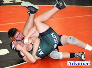 HURON 215-pounder Nick Toth works Alpena’s Noah Cannon in position for a first-round pin in action at the Bill Barrett Memorial tournament Tuesday in Rogers City. (Photo by Richard Lamb)