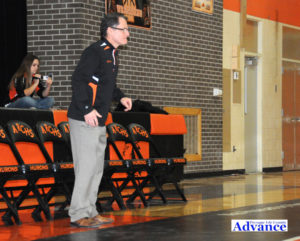 Huron wrestling coach George Sobeck keeps a close eye on action on the<div class='adsense adsense-bottom' style='float:right;margin:12px'><figcaption id=
