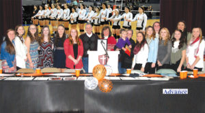 THE ROGERS CITY High School volleyball team was honored at a banquet hosted by the Advance Sunday, which was declared their “day” by the Rogers City City Council. Mayor Tom Sobeck presented a framed copy of the resolution passed by the council to head coach Jackie Quaine. Sobeck praised not only the players and coaches, but the parents who supported the girls during the season. The event was attended by more than 100 family members and friends of the program. (Photo by Peter Jakey)