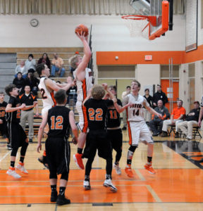 Huron center Evan Delke puts up a shot in fourth quarter action. (Photo by Richard Lamb)