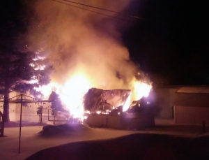 A neighbor captured images of an early-morning fire on Morley Drive in Rogers City which claimed a life Friday. (Photo courtesy of Nickie Rickle)
