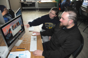 TEACHER BEN Witter works with computer broadcasting student Camryn Bullock during class Monday at the Mac-Lab at Rogers City High Scho<div class='adsense adsense-bottom' style='float:right;margin:12px'><figcaption id=