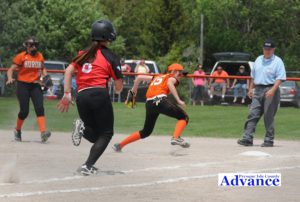 Hannah Dittmar completes a fine defensive play at first base when she stepped on the bag to retire the Whittemore hitter. 