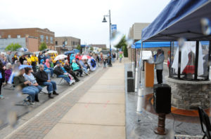 A little rain and wind didn't dampen the mood at the dedication Saturday at the corner of Third and Erie. (Photos by Richard Lamb)