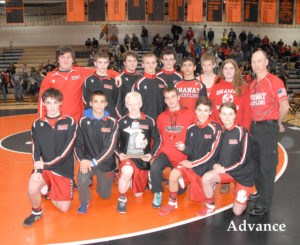 CELEBRATING A team wrestling district trophy are, front from left, Colby Pauly, Matthew Grant, Coty Ionetz, Teddy Peters, Aidan Fry, Brittney Wolgast, back, Garrett Roat, Seth Enos, Alex Connelly, Brendan Fenstermaker, Sam Tennant, Joey Galvez, Dylan Crowe, Maggie Grant and head coach Mark Grant. (Photo by Peter Jakey)