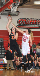 Taylor Fleming goes for two points as Posen's senior center Cami LaTulip defends. (Photo by Richard Lamb)