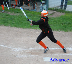Taylor Fleming watches the flight of her home run in the second game against Alpena Wednesday. (Photo by Richard Lamb)