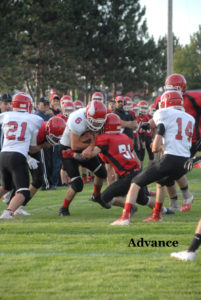 POSEN SENIOR running back Mark Wisniewski (6) was a workhorse for the Vikings with 35 carries. Here, he carried the load into a wall of Onaway defenders. (Photo by Peter Jakey)