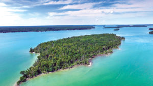 BROWN ISLAND provides plenty of privacy and tranquility. The island and the lodge will be auctioned late next month for the person who always has dreamed of owning and living on an island at Grand Lake. (Photos courtesy of Leist Auctioneers)