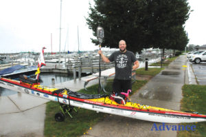 ADVENTURER RICH Brand paddled into the Rogers City Marina last week on his way up Lake Huron. He is paddling around America’s Great Loop, a trip he expects to finish next June. (Photo by Richard Lamb)