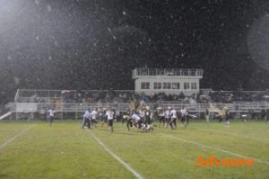 Snowy conditions made for a slick field in St. Ignace. (Photo by Richard Lamb)