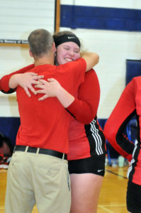 Senior Sunny Flory was all smiles as Onaway athletic director Marty Mix handed out regional championship medals congratulating each player with a hug.