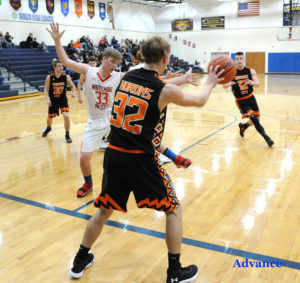 Kaleb Budnick sets up an inbounds pass under the W-P basket in Monday's win over the Cardinals. (Photo by Richard Lamb)