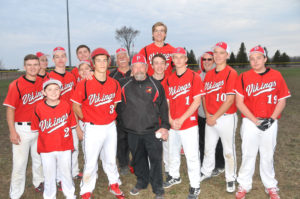 POSEN VARSITY baseball coach Pat Kowalski, who is surrounded by his 2019 Vikings, is this year’s Rogers City Little League grand marshal. This is his 35th year of coaching baseball. (Photo by Peter Jakey)