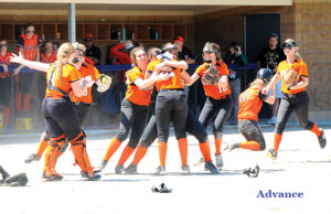 Huron players mob pitcher Kyrsten Altman after the final out came on a tag at third base. (Photo by Richard Lamb)