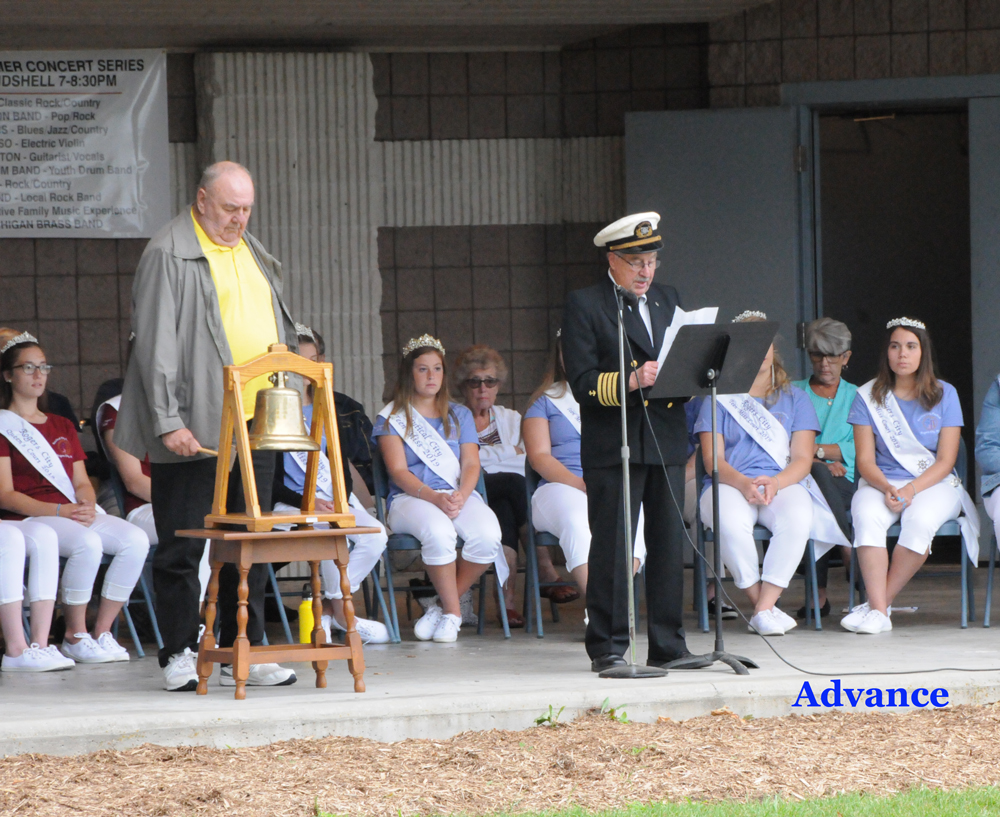 Cedarville survivor Robert Bingle rang the bell in memory of sailors lost as Capt. Richard Peacock read the names during Tuesday's sailors' memorial at Lakeside Park. (Photo by Richard Lamb)
