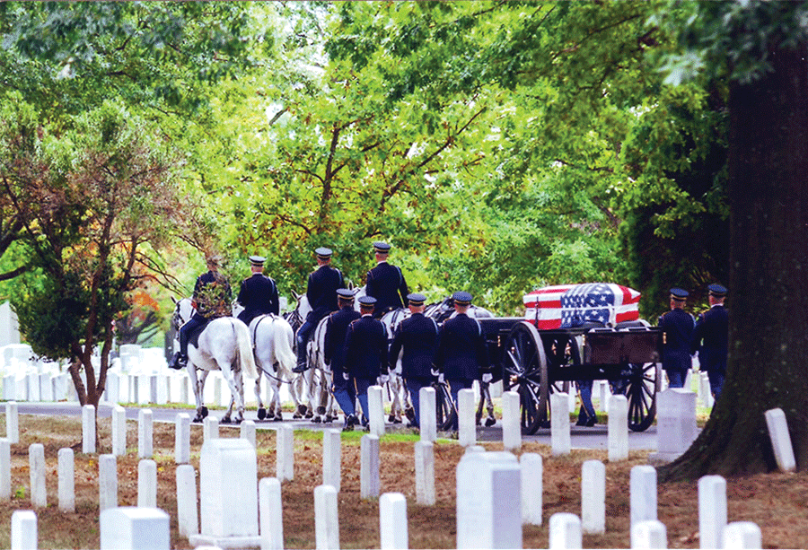 THE BODY of Rogers City native Duane Haneckow Sr. is brought to his final resting place by a military honor guard. 