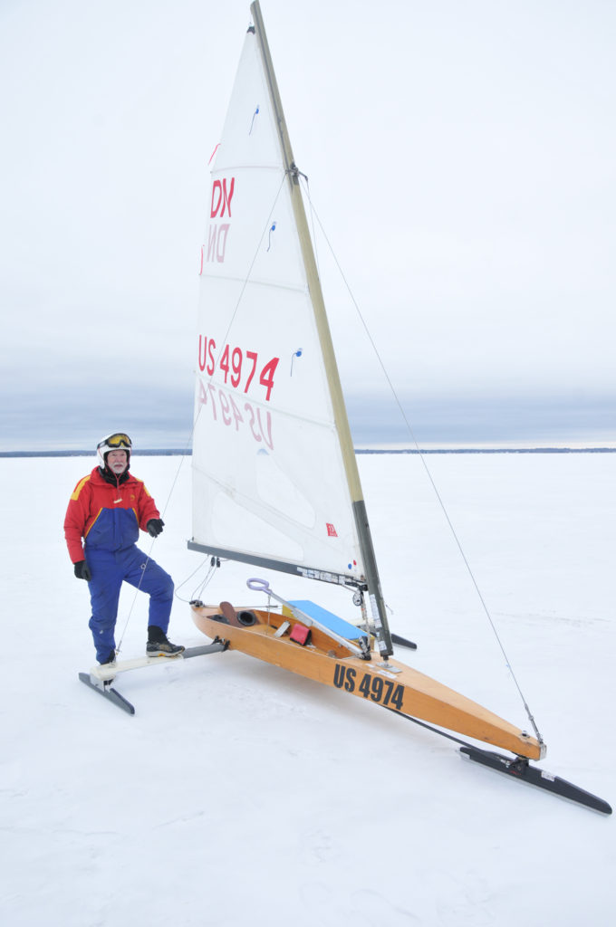 STAN JONES, 82, of Montague was a little tired but invigorated after a morning of racing his iceboat in the middle of Black Lake. (Photo by Peter Jakey)
